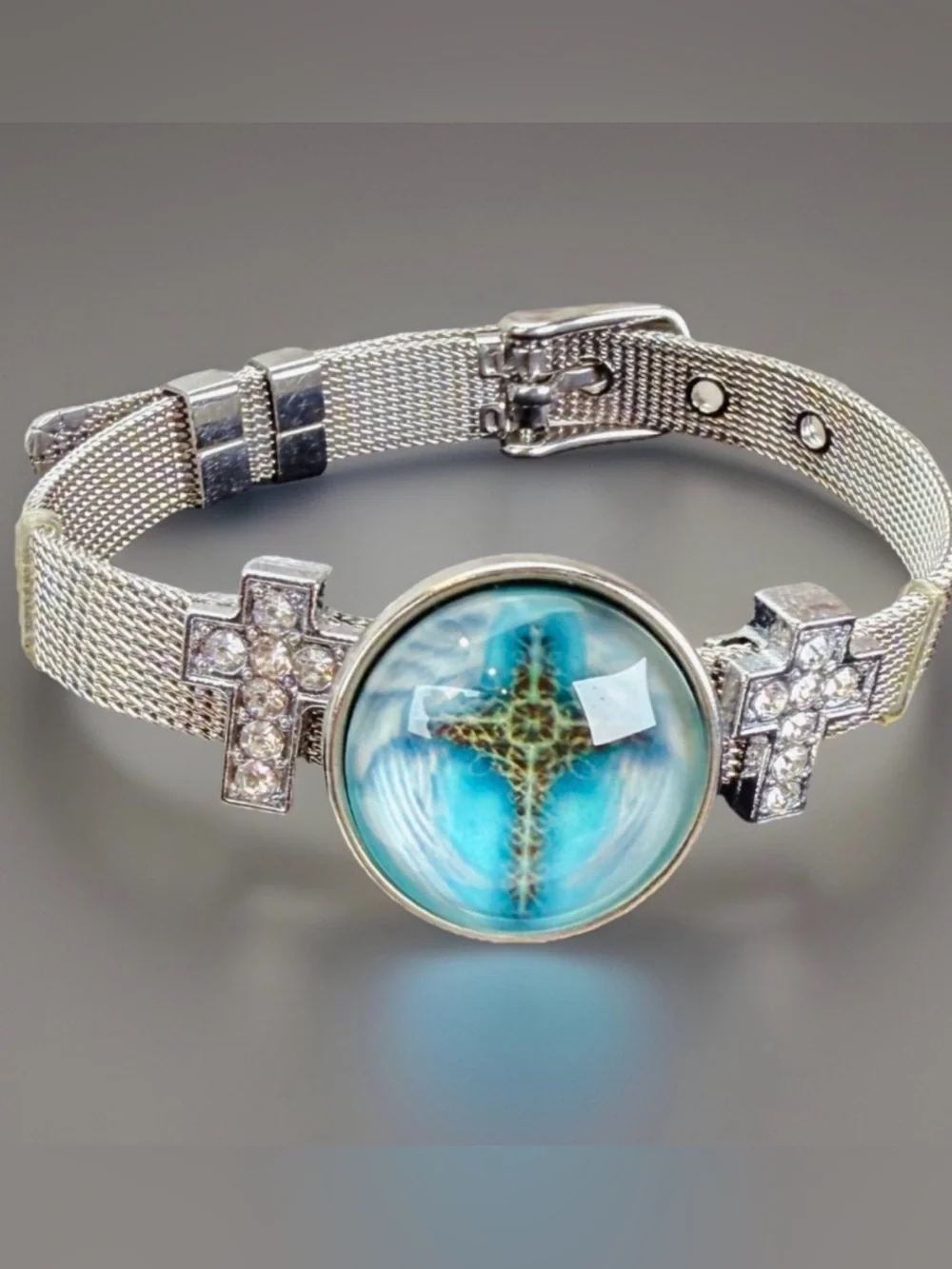 Silvertone Mesh Snap Bracelet with Blue Cross Design